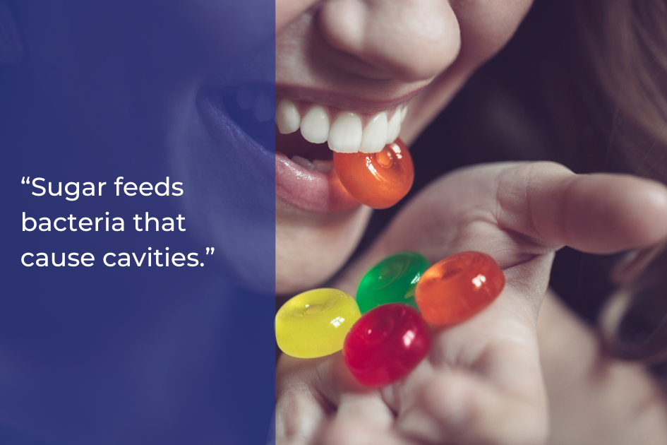 A person holds colorful candies and places one in their mouth. The image includes the text: "Sugar in foods feeds bacteria that cause cavities," highlighting its impact on dental health.